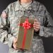 Soldier holding a Christmas gift