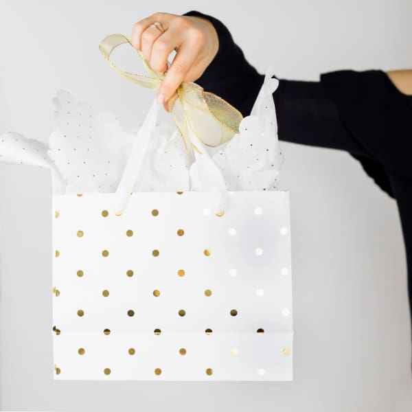 Wife holding gift bag